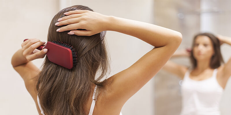 Women Brushing Her Hair