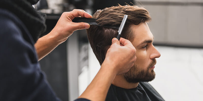 man getting hair cut